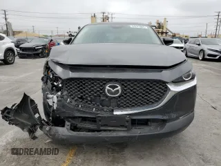 2025 Mazda CX-30 S with VIN 3MVDMBAMXSM778811, listed as a Copart auction lot 54241865 with 8,822 mi miles and Salvage title. Bid and sale history available at DreamBid. Image 5.