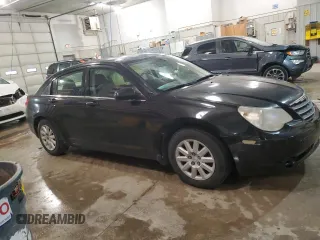 2010 Chrysler Sebring Touring with VIN 1C3CC4FBXAN112107, listed as a Copart auction lot 53942745 with 134,629 mi miles and Salvage Title. Bid and sale history available at carsss.com. Image 4.