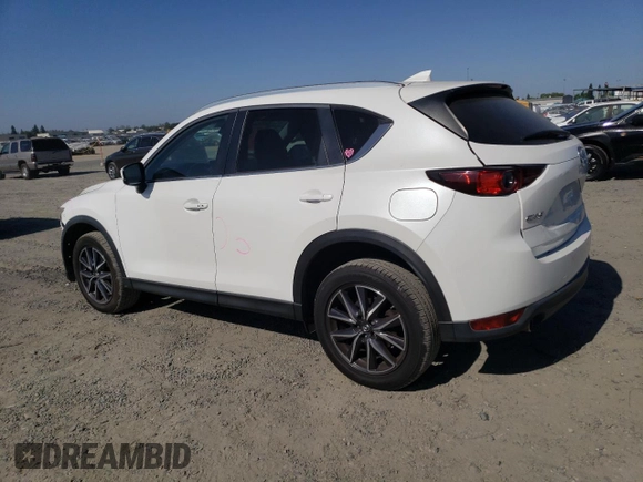 2018 Mazda CX-5 Touring z VIN JM3KFACM7J0370737, wystawiony jako Copart lot #60113725 z przebiegiem 131 385 mil mil oraz Szkoda całkowita • Salvage title. Historia ofert i sprzedaży dostępna na DreamBid. Obrazek 2.