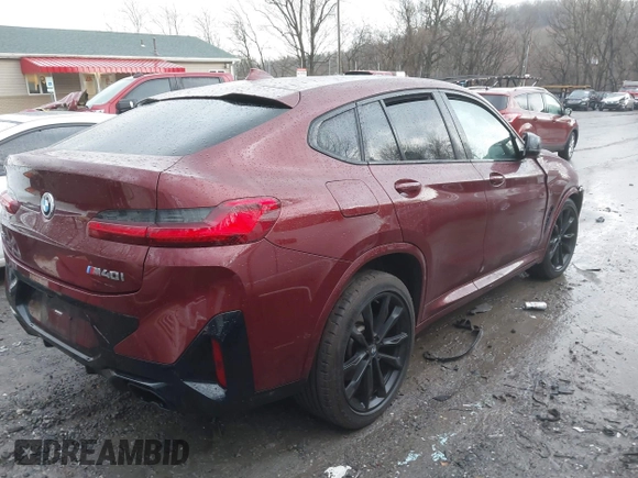 2022 BMW X4 M40i with VIN 5UX43DT09N9J96761, listed as a IAAI auction lot 41675333 with Not provided miles and . Bid and sale history available at DreamBid. Image 4.