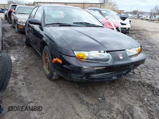 2000 Saturn SL z VIN 1G8ZK527XYZ102481, wystawiony jako IAAI lot #41911431 z przebiegiem 96 965 mil mil oraz . Historia ofert i sprzedaży dostępna na DreamBid. Obrazek 1.
