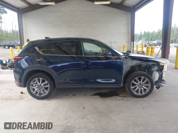 2019 Mazda CX-5 Grand Touring with VIN JM3KFBDM6K0522903, listed as a IAAI auction lot 42583005 with 61,174 mi miles and . Bid and sale history available at DreamBid. Image 14.