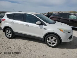 2015 Ford Escape SE with VIN 1FMCU0GX9FUC26779, listed as a Copart auction lot 52772325 with 135,121 mi miles and Salvage Title. Bid and sale history available at DreamBid. Image 4.