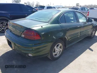 2000 Pontiac Grand Am SE1 with VIN 1G2NF52T0YM808611, listed as a IAAI auction lot 41943125 with 132,887 mi miles. Bid and sale history available at carsss.com. Image 4.