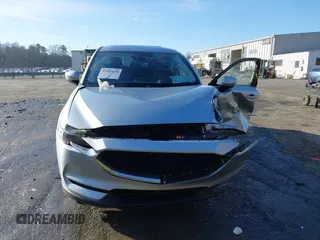 2020 Mazda CX-5 Grand Touring z VIN JM3KFADM0L0738337, wystawiony jako IAAI lot #41485078 z przebiegiem Nie podano mil oraz . Historia ofert i sprzedaży dostępna na DreamBid. Obrazek 11.