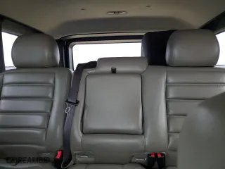 2005 Hummer H2 SUV with VIN 5GRGN23UX5H116341, listed as a Copart auction lot 76877704 with 145,778 mi miles and Salvage Title. Bid and sale history available at carsss.com. Image 10.