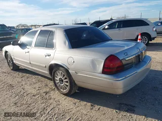 2011 Mercury Grand Marquis LS with VIN 2MEBM7FVXBX605591, listed as a IAAI auction lot 41714845 with 200,623 mi miles. Bid and sale history available at carsss.com. Image 3.