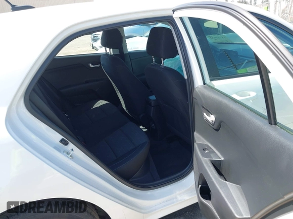 2023 Kia Rio S with VIN 3KPA25AD0PE629868, listed as a IAAI auction lot 41738952 with 25,642 mi miles and . Bid and sale history available at DreamBid. Image 8.