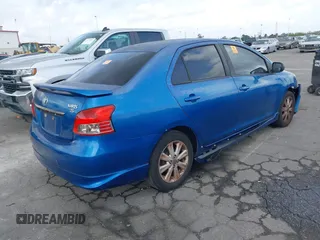 2009 Toyota Yaris with VIN JTDBT903591323255, listed as a IAAI auction lot 41933401 with 88,558 mi miles and . Bid and sale history available at DreamBid. Image 4.