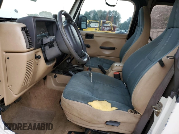 2000 Jeep Wrangler Sahara with VIN 1J4FA59SXYP760278, listed as a Copart auction lot 60402485 with 192,161 mi miles and Salvage title. Bid and sale history available at DreamBid. Image 7.