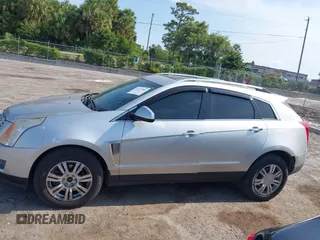2014 Cadillac SRX Luxury Collection z VIN 3GYFNEE36ES652353, wystawiony jako IAAI lot #42233986 z przebiegiem 146 029 mil mil oraz . Historia ofert i sprzedaży dostępna na DreamBid. Obrazek 14.