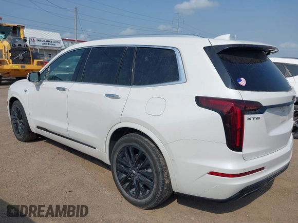 2022 Cadillac XT6 Premium Luxury with VIN 1GYKPCRS2NZ127050, listed as a IAAI auction lot 42072418 with 31,165 mi miles and . Bid and sale history available at DreamBid. Image 3.