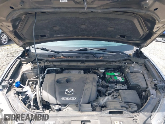 2016 Mazda CX-5 Sport with VIN JM3KE4BY8G0785812, listed as a IAAI auction lot 42324083 with 57,405 mi miles and . Bid and sale history available at DreamBid. Image 10.