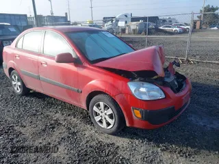 2009 Kia Rio LX with VIN KNADE223796485606, listed as a IAAI auction lot 41676881 with 58,852 mi miles and . Bid and sale history available at DreamBid. Image 1.