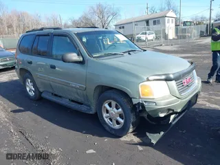 2004 GMC Envoy SLE with VIN 1GKDT13S942254932, listed as a IAAI auction lot 41509407 with 213,068 mi miles. Bid and sale history available at carsss.com. Image 1.