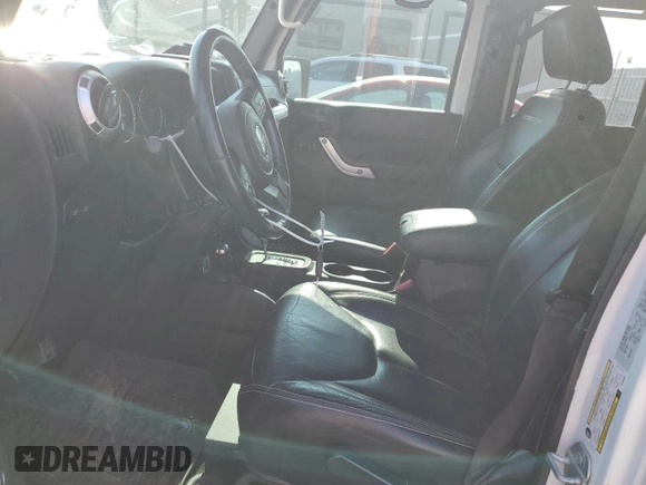 2015 Jeep Wrangler Unlimited Rubicon with VIN 1C4BJWFG1FL750561, listed as a Copart auction lot 60797075 with 95,677 mi miles and Salvage title. Bid and sale history available at DreamBid. Image 7.
