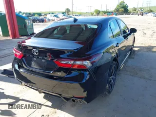2023 Toyota Camry SE z VIN 4T1G11AKXPU747251, wystawiony jako IAAI lot #42388819 z przebiegiem 39 542 mil mil oraz . Historia ofert i sprzedaży dostępna na DreamBid. Obrazek 4.