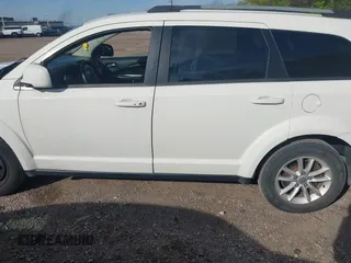 2017 Dodge Journey SXT z VIN 3C4PDCBG9HT589904, wystawiony jako IAAI lot #42084994 z przebiegiem 130 194 mil mil oraz . Historia ofert i sprzedaży dostępna na DreamBid. Obrazek 14.