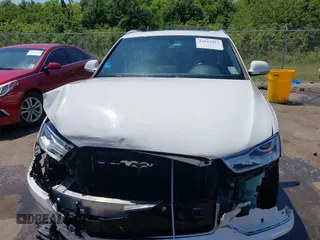 2018 Audi Q3 Premium with VIN WA1BCCFS4JR000455, listed as a IAAI auction lot 42042811 with 57,354 mi miles. Bid and sale history available at carsss.com. Image 12.