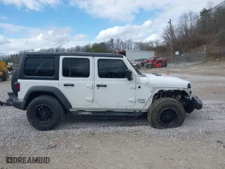 2019 Jeep Wrangler Unlimited Sport S with VIN 1C4HJXDG3KW604576, listed as a IAAI auction lot 41726805 with 89,118 mi miles. Bid and sale history available at carsss.com. Image 14.