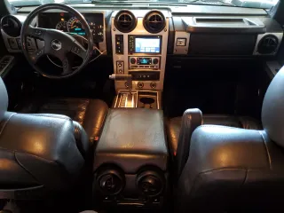 2005 Hummer H2 SUV z VIN 5GRGN23U65H127711, wystawiony jako Copart lot #53180865 z przebiegiem 178 085 mil mil oraz Szkody całkowita. Historia ofert i sprzedaży dostępna na DreamBid. Obrazek 8.