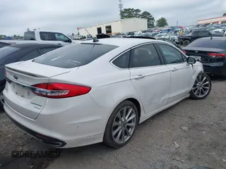 2017 Ford Fusion Titanium with VIN 3FA6P0K96HR105127, listed as a IAAI auction lot 39351701 with 103,295 mi miles. Bid and sale history available at carsss.com. Image 4.