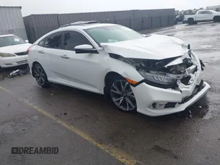 2020 Honda Civic Sedan Touring with VIN 19XFC1F91LE210390, listed as a IAAI auction lot 41766652 with 67,269 mi miles. Bid and sale history available at carsss.com. Image 1.