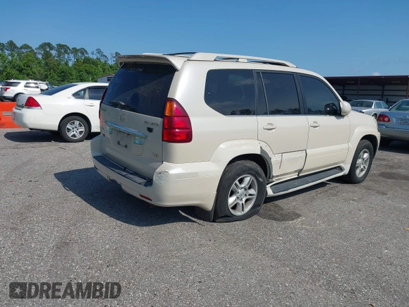 2003 Lexus GX 470 with VIN JTJBT20X630019033, listed as a IAAI auction lot 42128698 with 286,811 mi miles and . Bid and sale history available at DreamBid. Image 4.