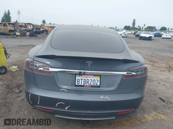 2013 Tesla Model S with VIN 5YJSA1AG5DFP13149, listed as a IAAI auction lot 42116437 with 140,999 mi miles. Bid and sale history available at carsss.com. Image 17.