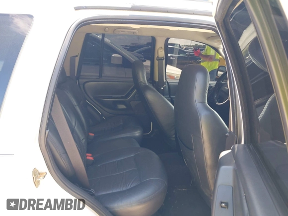 2004 Jeep Grand Cherokee Laredo z VIN 1J4GX48S74C152542, wystawiony jako IAAI lot #42350507 z przebiegiem 176 366 mil mil oraz . Historia ofert i sprzedaży dostępna na DreamBid. Obrazek 8.