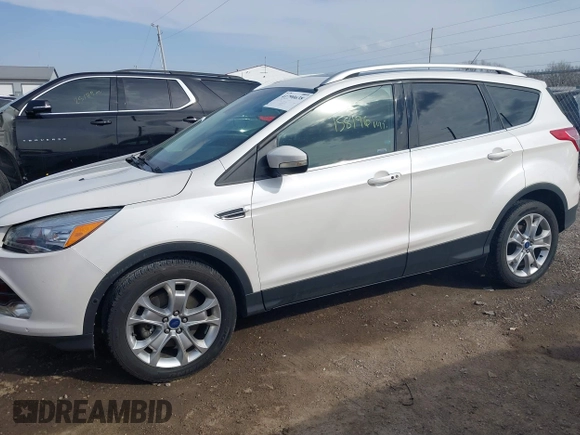 2015 Ford Escape Titanium with VIN 1FMCU9J98FUC76491, listed as a IAAI auction lot 41790638 with 158,196 mi miles and . Bid and sale history available at DreamBid. Image 14.