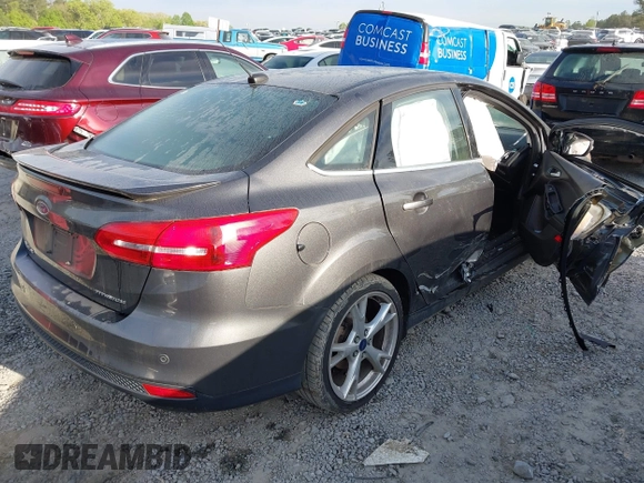 2016 Ford Focus Titanium with VIN 1FADP3J25GL282293, listed as a IAAI auction lot 41998959 with 119,781 mi miles and . Bid and sale history available at DreamBid. Image 4.