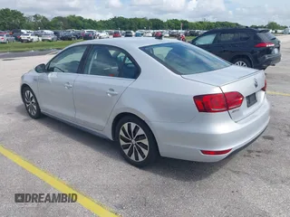 2013 Volkswagen Jetta Hybrid SEL with VIN 3VW637AJ2DM233265, listed as a IAAI auction lot 42746158 with 105,779 mi miles and . Bid and sale history available at DreamBid. Image 3.
