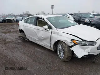 2015 Ford Fusion SE z VIN 3FA6P0HD1FR180083, wystawiony jako IAAI lot #41535579 z przebiegiem 109 363 mil mil oraz . Historia ofert i sprzedaży dostępna na DreamBid. Obrazek 6.