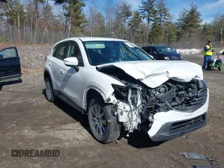 2016 Mazda CX-5 Sport with VIN JM3KE2BY9G0887110, listed as a IAAI auction lot 41761039 with 86,624 mi miles. Bid and sale history available at carsss.com. Image 6.