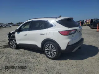 2020 Ford Escape Titanium Hybrid z VIN 1FMCU9DZ6LUC47658, wystawiony jako Copart lot #59599995 z przebiegiem 63 004 mil mil oraz Szkoda całkowita • Salvage title. Historia ofert i sprzedaży dostępna na DreamBid. Obrazek 2.