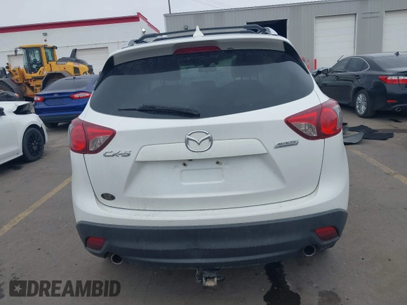 2016 Mazda CX-5 Grand Touring z VIN JM3KE2DY8G0885006, wystawiony jako IAAI lot #41615873 z przebiegiem 118 890 mil mil oraz . Historia ofert i sprzedaży dostępna na DreamBid. Obrazek 16.
