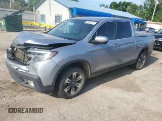 2018 Honda Ridgeline RTL-T with VIN 5FPYK3F67JB011730, listed as a Copart auction lot 61055715 with 121,193 mi miles and Salvage title. Bid and sale history available at DreamBid. Image 1.