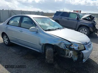 2004 Kia Spectra LX with VIN KNAFE122645052206, listed as a IAAI auction lot 41767864 with 63,866 mi miles. Bid and sale history available at carsss.com. Image 1.