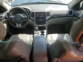 2013 Jeep Grand Cherokee Laredo with VIN 1C4RJEAG2DC519570, listed as a Copart auction lot 52066225 with 129,091 mi miles and Salvage Title. Bid and sale history available at carsss.com. Image 8.