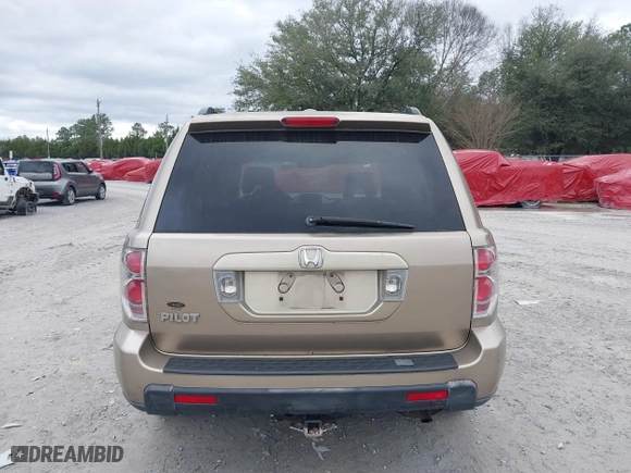 2006 Honda Pilot EX-L with VIN 5FNYF28566B010295, listed as a IAAI auction lot 41654433 with 302,539 mi miles. Bid and sale history available at carsss.com. Image 16.