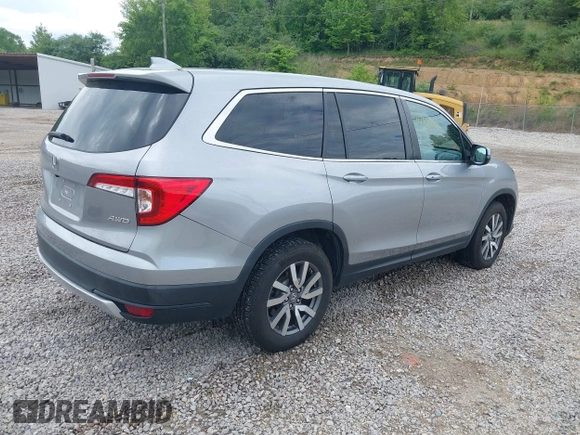 2021 Honda Pilot EX-L with VIN 5FNYF6H50MB063465, listed as a IAAI auction lot 42160636 with 28,595 mi miles and . Bid and sale history available at DreamBid. Image 4.