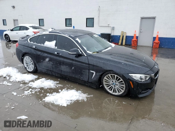2015 BMW 4 Series 428i xDrive with VIN WBA4C9C54FD330601, listed as a Copart auction lot 45168955 with 112,408 mi miles and Salvage title. Bid and sale history available at DreamBid. Image 4.