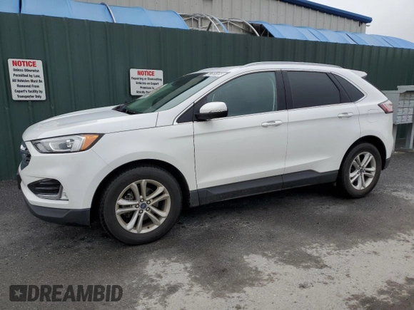 2020 Ford Edge SEL z VIN 2FMPK3J90LBB01559, wystawiony jako Copart lot #61365305 z przebiegiem 120 050 mil mil oraz Czysty tytuł • Clean title. Historia ofert i sprzedaży dostępna na DreamBid. Obrazek 1.