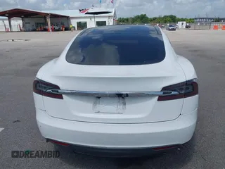 2014 Tesla Model S 60 with VIN 5YJSA1H12EFP39582, listed as a IAAI auction lot 42545143 with 117,383 mi miles and . Bid and sale history available at DreamBid. Image 16.