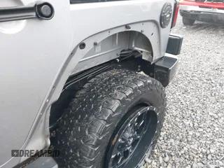 2016 Jeep Wrangler Unlimited 75th Anniversary with VIN 1C4BJWEG6GL170760, listed as a IAAI auction lot 41953745 with 72,827 mi miles and . Bid and sale history available at DreamBid. Image 13.