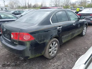 2007 Kia Optima LX with VIN KNAGE124975133923, listed as a IAAI auction lot 42007990 with 87,768 mi miles. Bid and sale history available at carsss.com. Image 4.