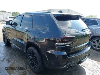 2014 Jeep Grand Cherokee SRT-8 z VIN 1C4RJFDJ2EC174412, wystawiony jako IAAI lot #42116541 z przebiegiem 124 693 mil mil oraz . Historia ofert i sprzedaży dostępna na DreamBid. Obrazek 3.