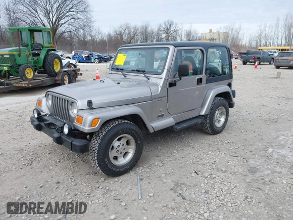 2001 Jeep Wrangler Sport z VIN 1J4FA49S31P349269, wystawiony jako IAAI lot #41427014 z przebiegiem 112 421 mil mil oraz . Historia ofert i sprzedaży dostępna na DreamBid. Obrazek 2.