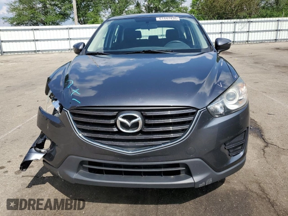 2016 Mazda CX-5 Sport z VIN JM3KE2BY4G0632946, wystawiony jako Copart lot #61447435 z przebiegiem 178 492 mil mil oraz Szkoda całkowita • Salvage title. Historia ofert i sprzedaży dostępna na DreamBid. Obrazek 5.